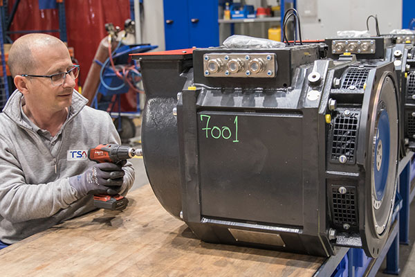 TSA employee working on stator