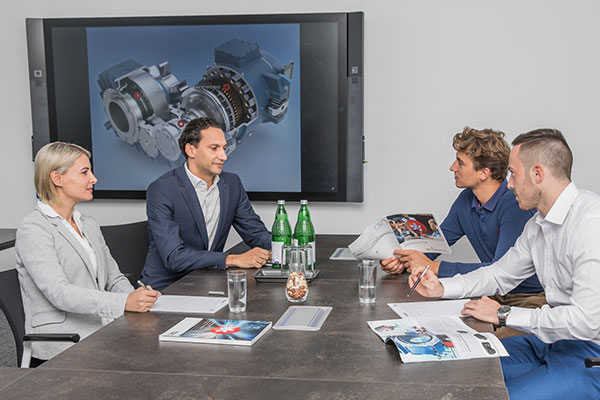 Consulting scene man and woman with two clients in office