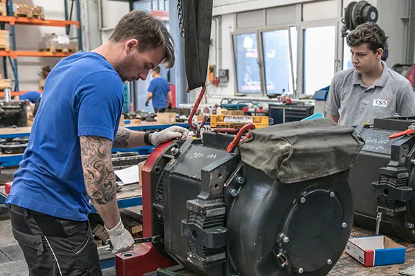 TSA employees during service work traction motor